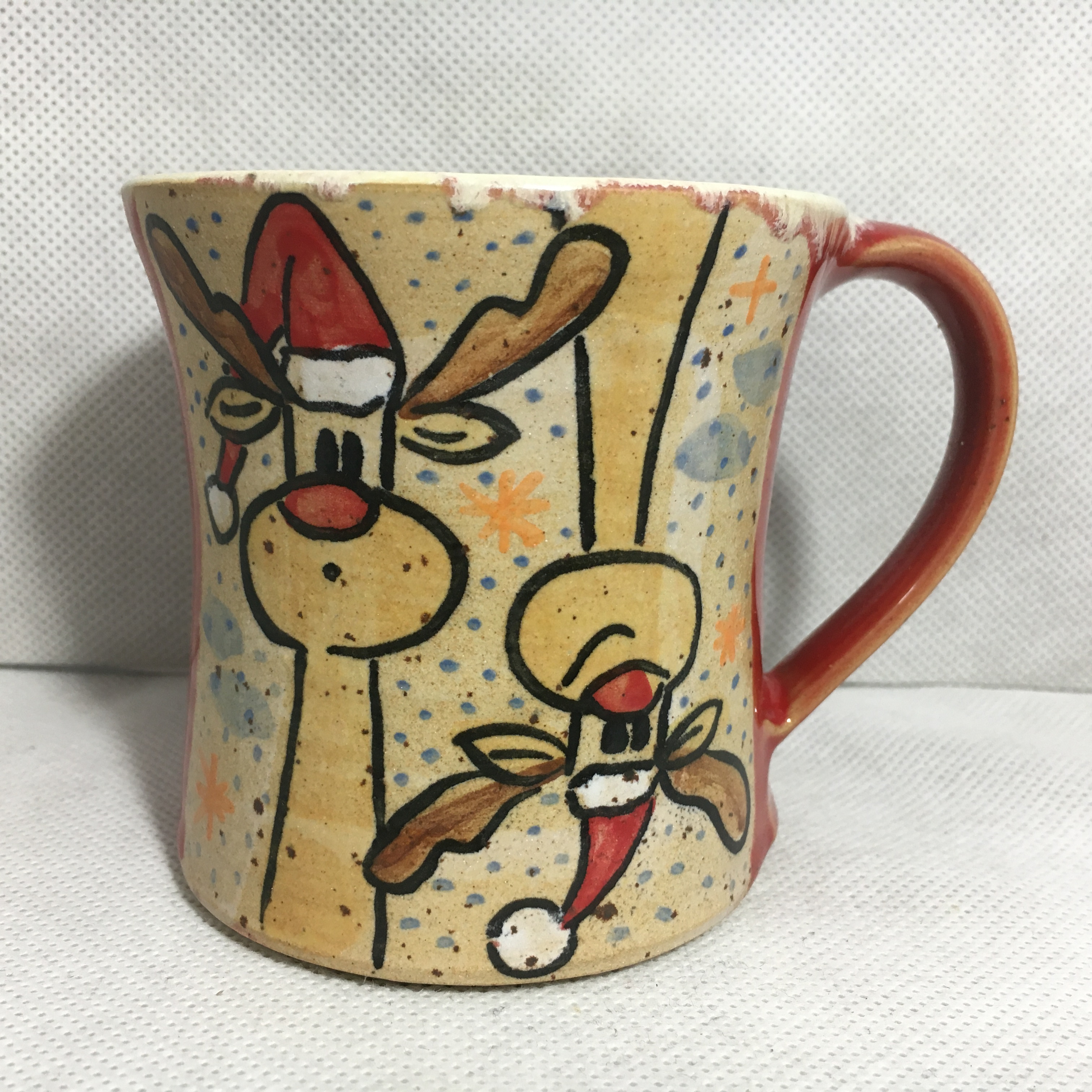 Keramiktasse Rudi Rednose, winterliche Geschenkidee aus Handarbeit